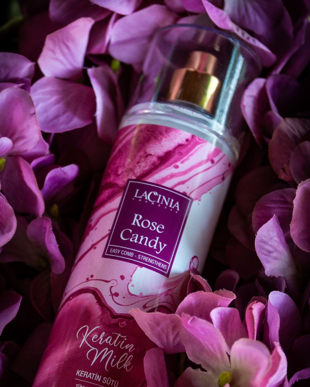 Rose Candy Keratin Hair Milk among purple flowers