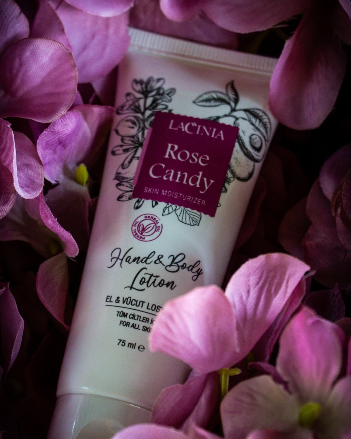 Rose Candy Hand & Body Lotion among purple flowers
